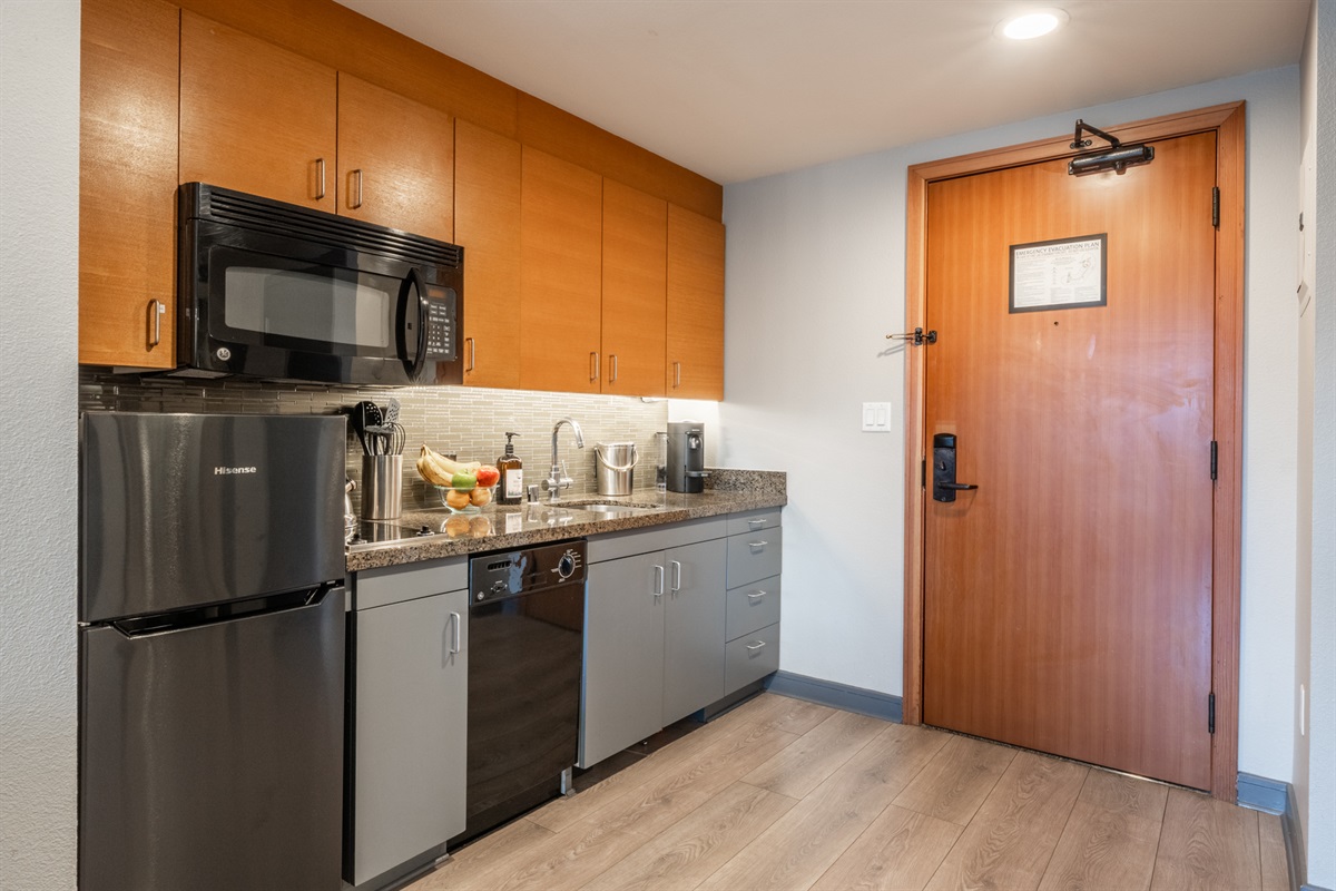 The kitchen sits just inside the entry—convenient and easy for bringing in groceries and keeping cooking contained from the living space.