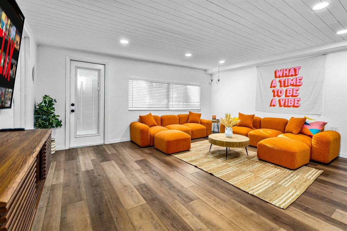 Retro living room with 75-inch LED TV.