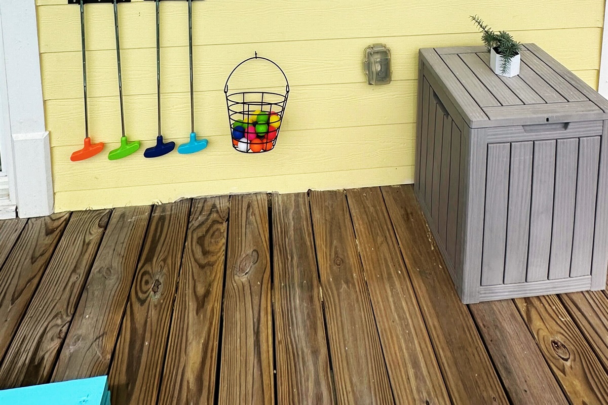 Family-friendly mini golf course with colorful clubs and obstacles.