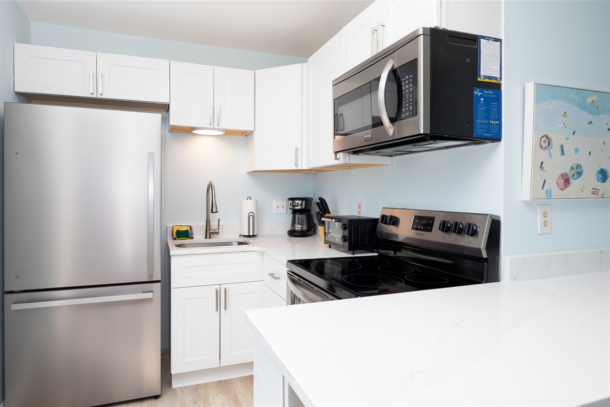 Updated Kitchen with stainless appliances and quartz counters