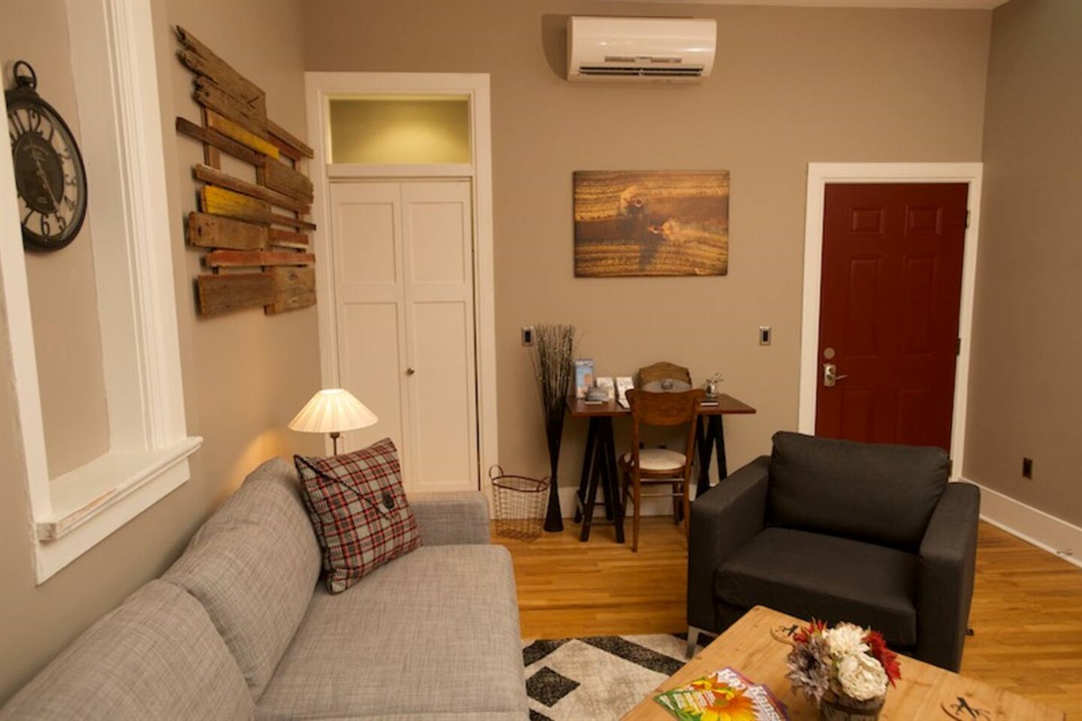 Work desk rests between closet (left) and door to the laundry room (right)