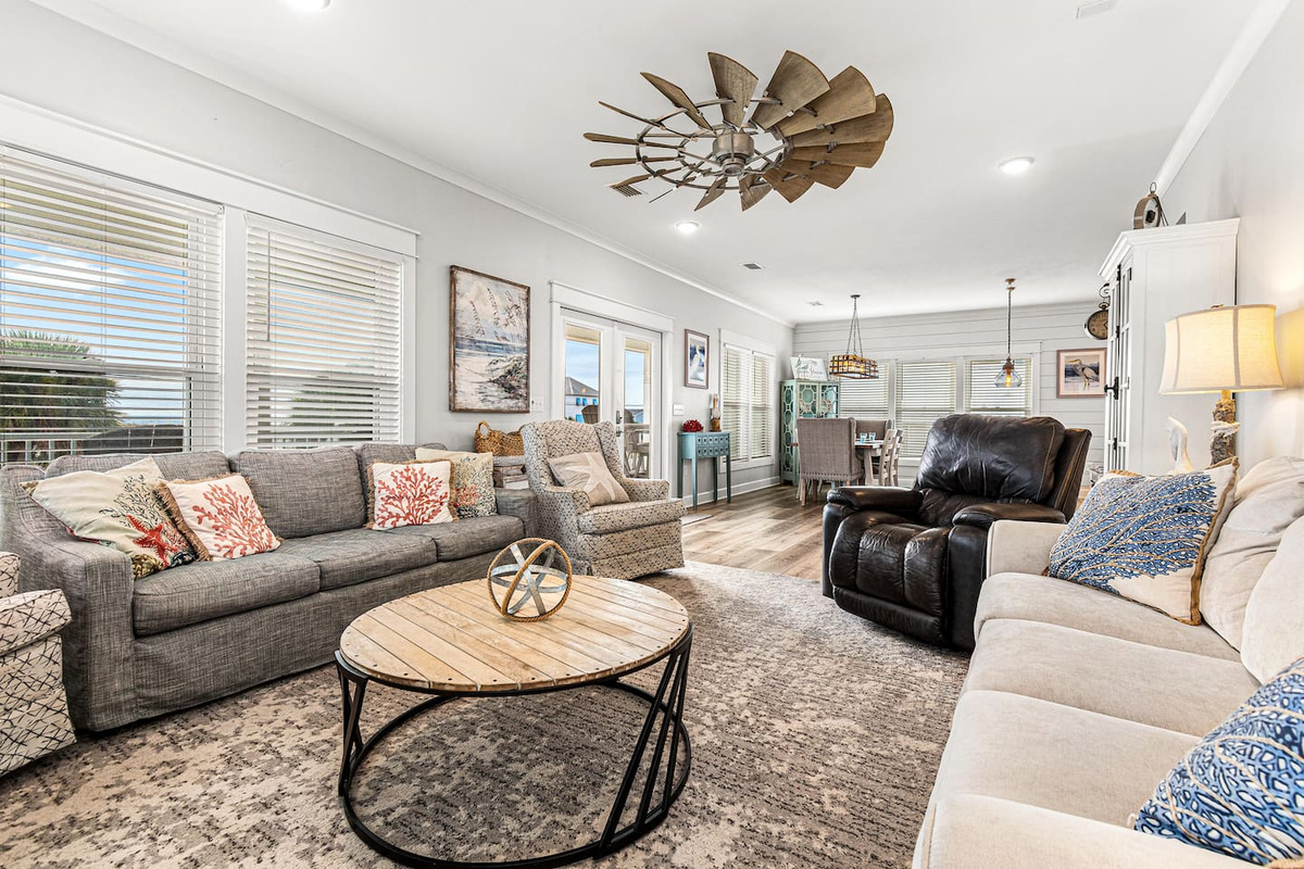 Amazingly comfortable family room that will seat nine guests complimented by a 65" TV.