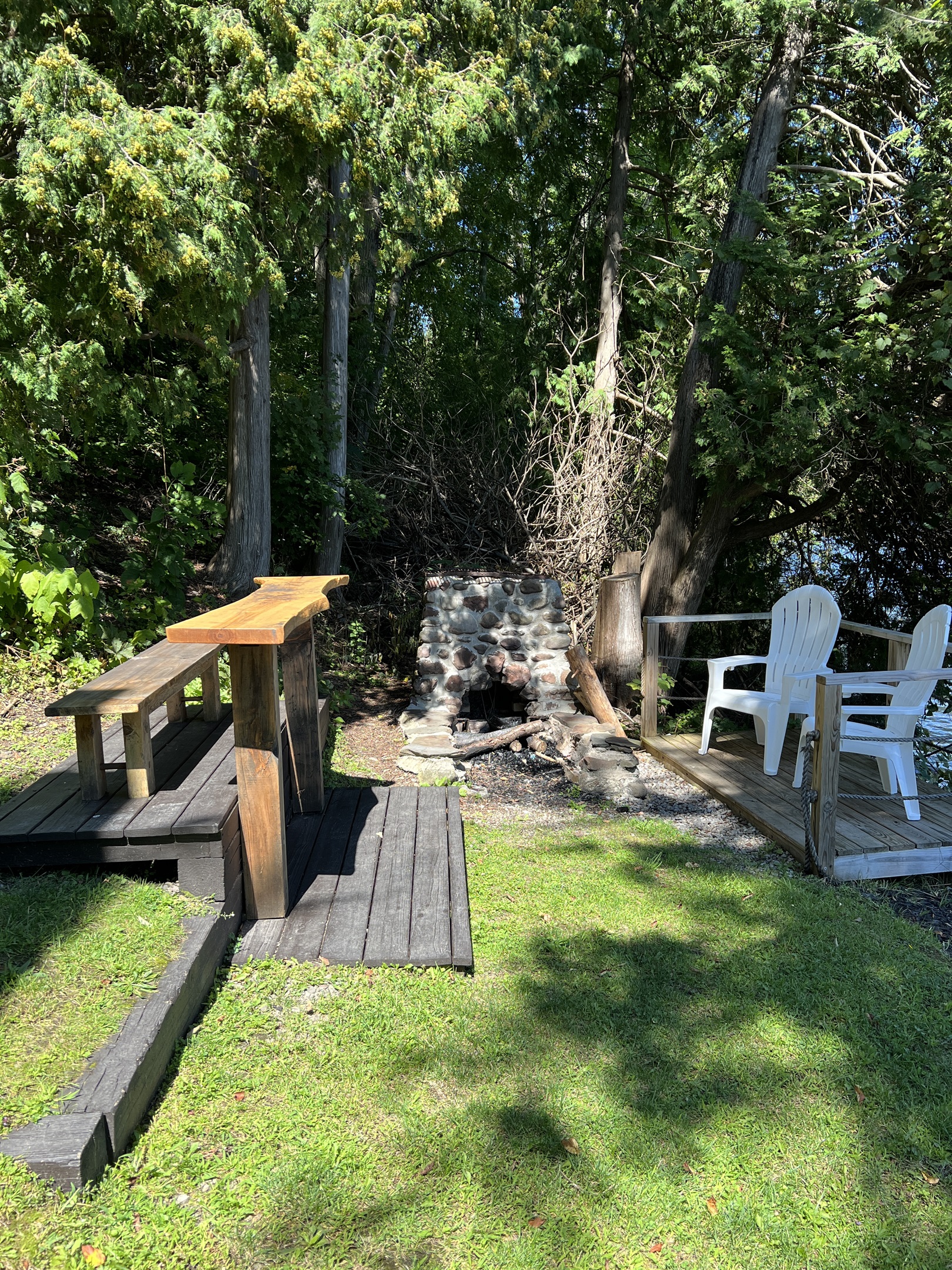 The Adirondack Waterfront Compound main house firepit.