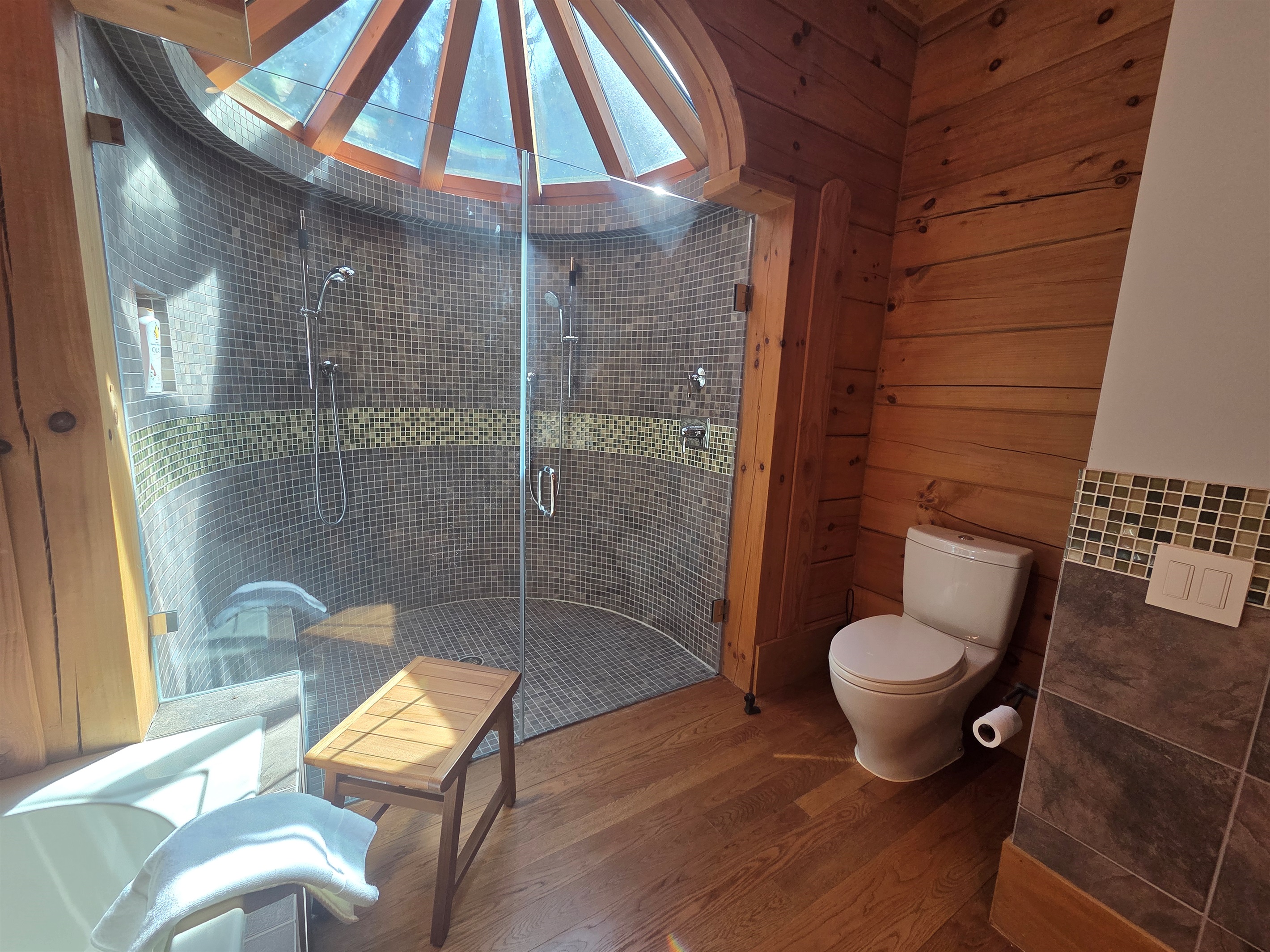 Spa-like second bedroom bathroom with a soaking tub and a large walk-in shower.