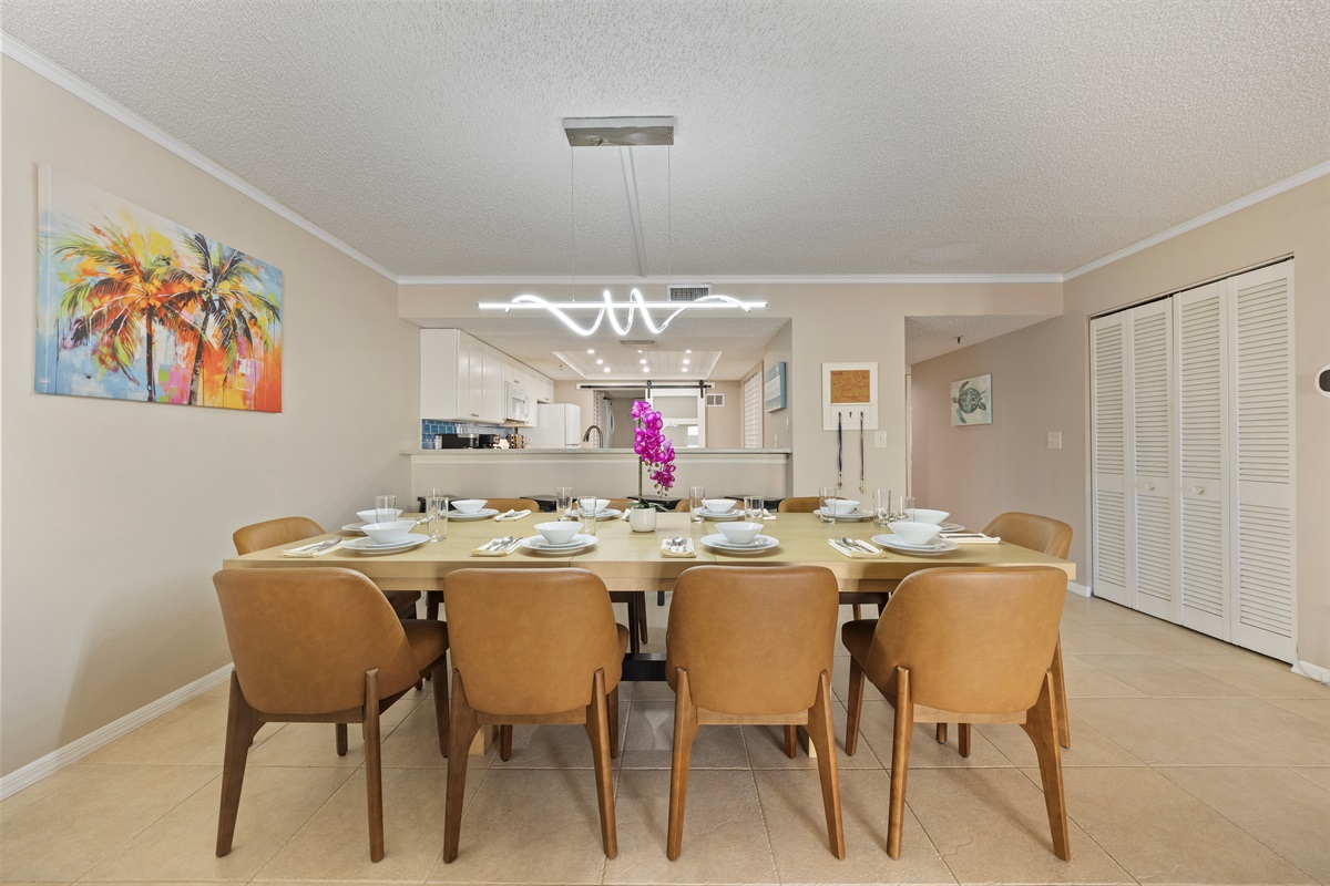 Dining room table seats 10 plus 3 additional bar stools.