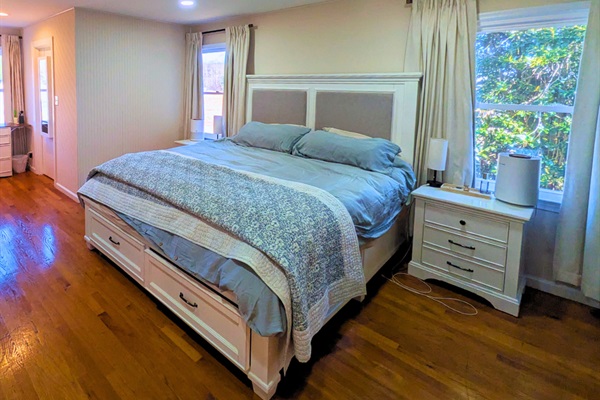 Peaceful bedroom retreat with a comfortable bed and calming space to unwind.