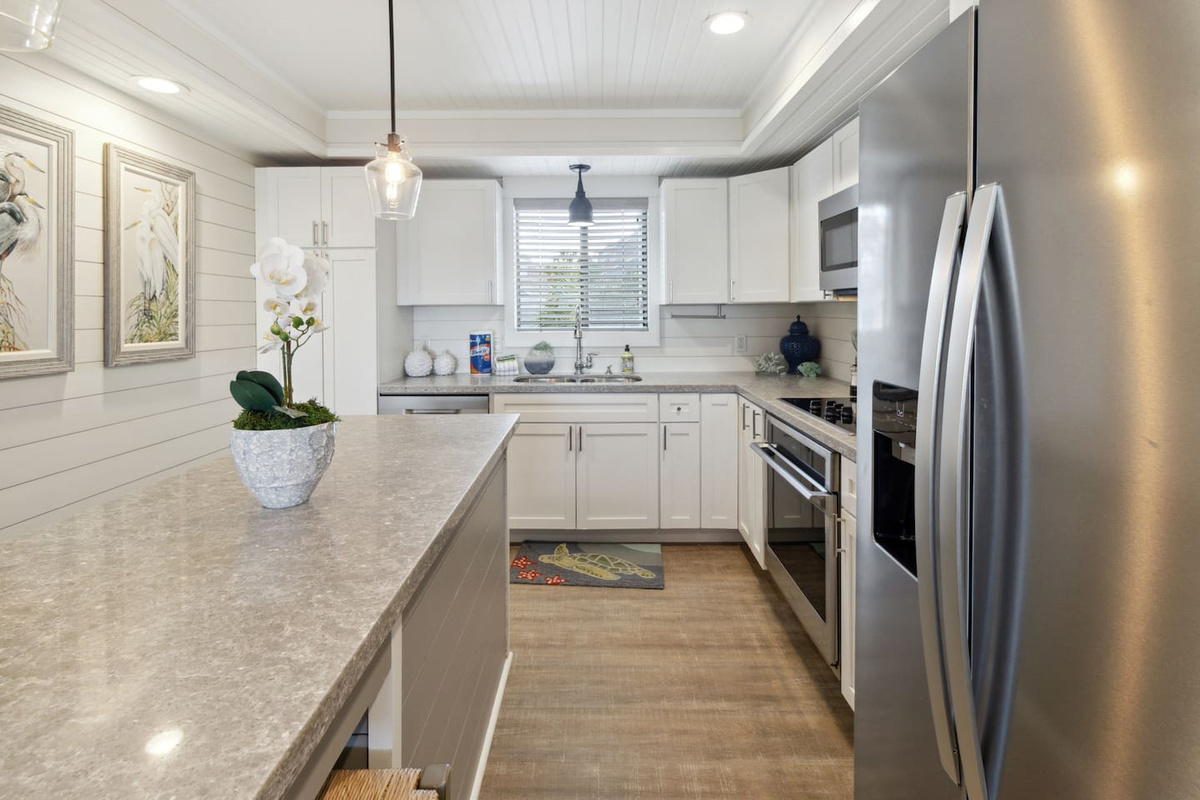 French door refrigerator with water and ice in the door &mdash; stocked for a beach week, ready when you arrive.