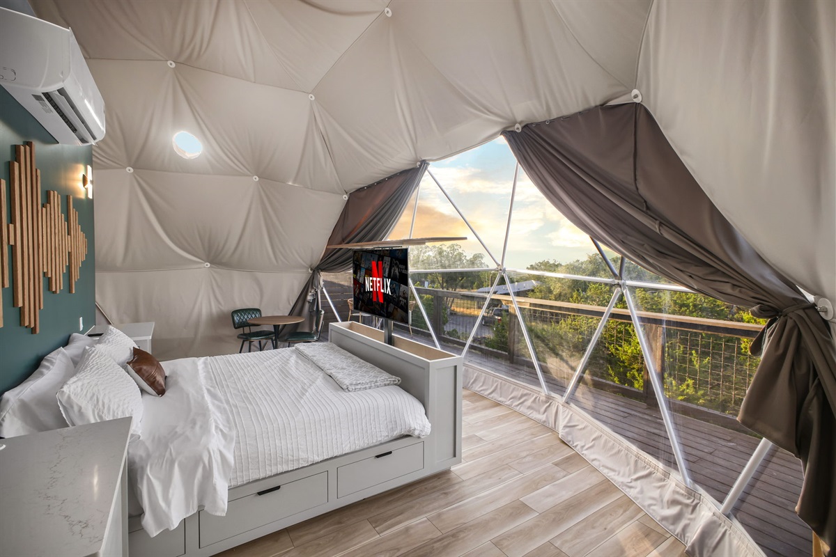 A unique feature guests love: a TV that seamlessly rises from the bed frame when you’re ready to relax.