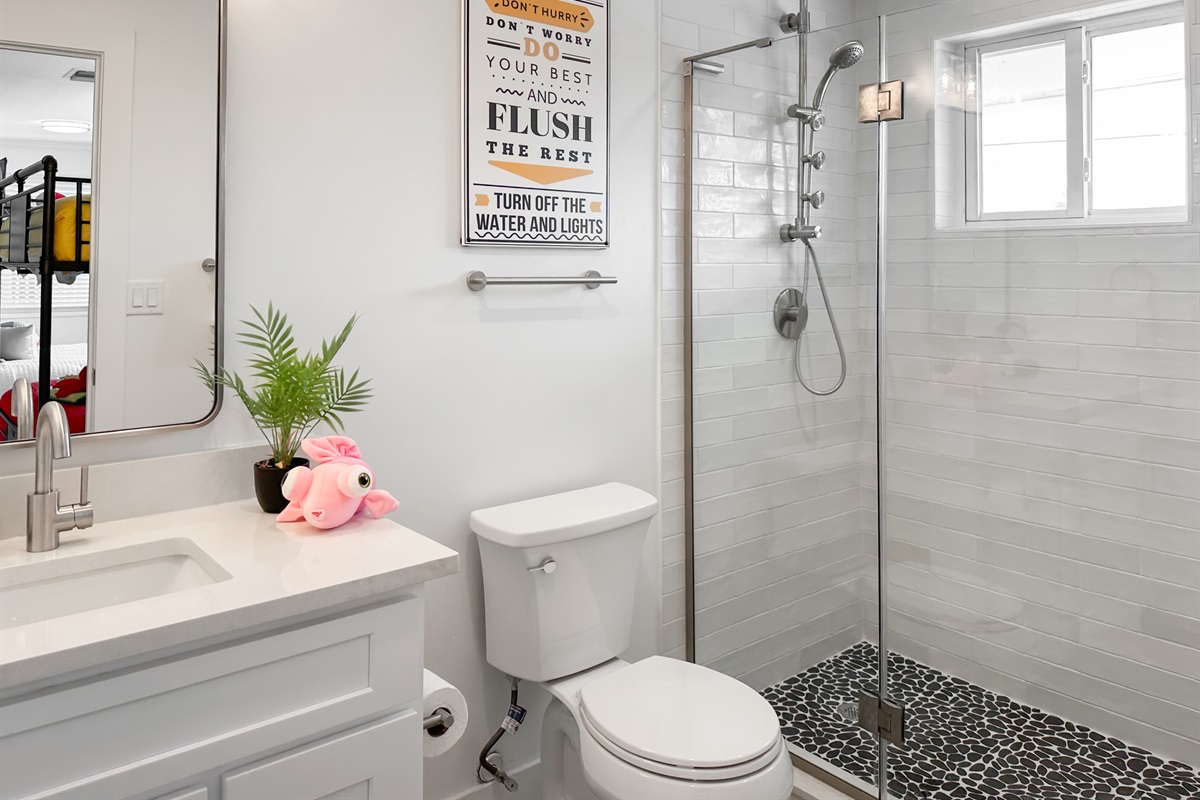 The bunk room has a full en-suite bathroom with a walk-in shower.