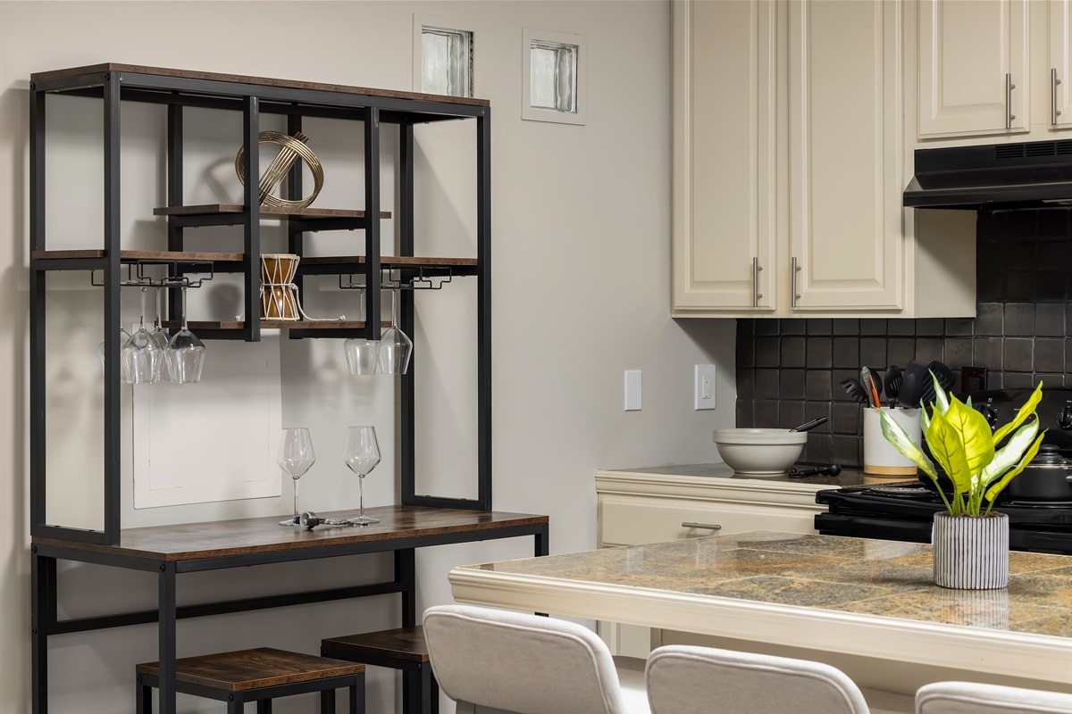 Chic and inviting, our kitchenette doubles as a sophisticated wine bar, where you can unwind with your favorite vintages, complemented by shatterproof glassware. Reach out to us for our person