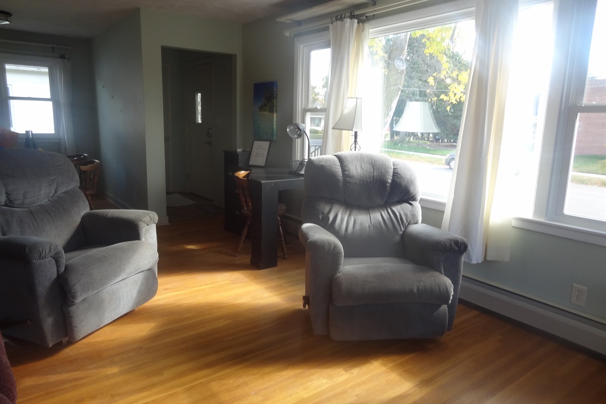 Full size couch, 2 recliners, Roku smart TV, laptop work space