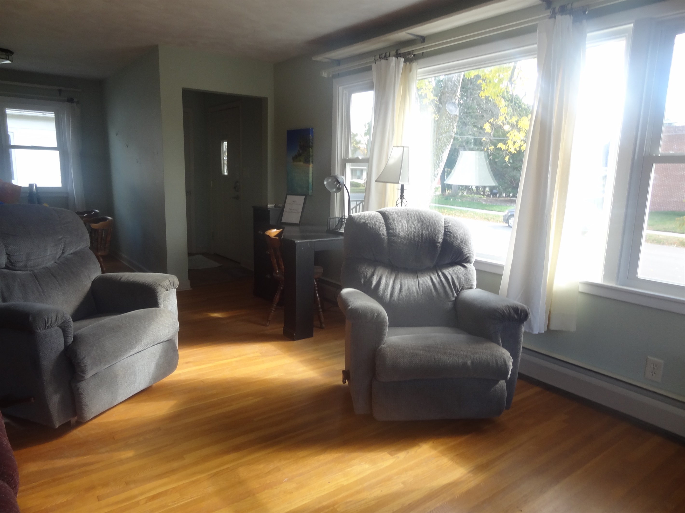 Full size couch, 2 recliners, Roku smart TV, laptop work space