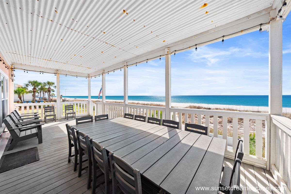 On the upper deck, two dining tables are crowned with string lights so the party doesn't have to end when the sun goes down!