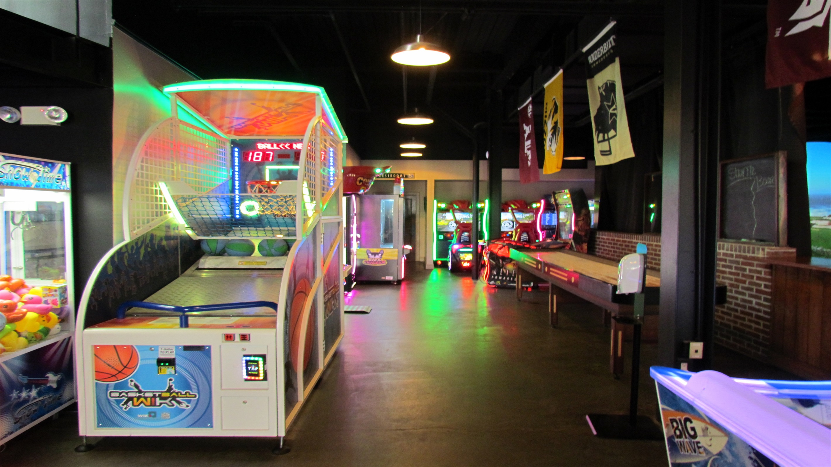 Test your skills at the Village Hideaway arcade, featuring a vibrant collection of games, including classic Skee-Ball and basketball hoops. Challenge your friends to a game and see who comes out on top!