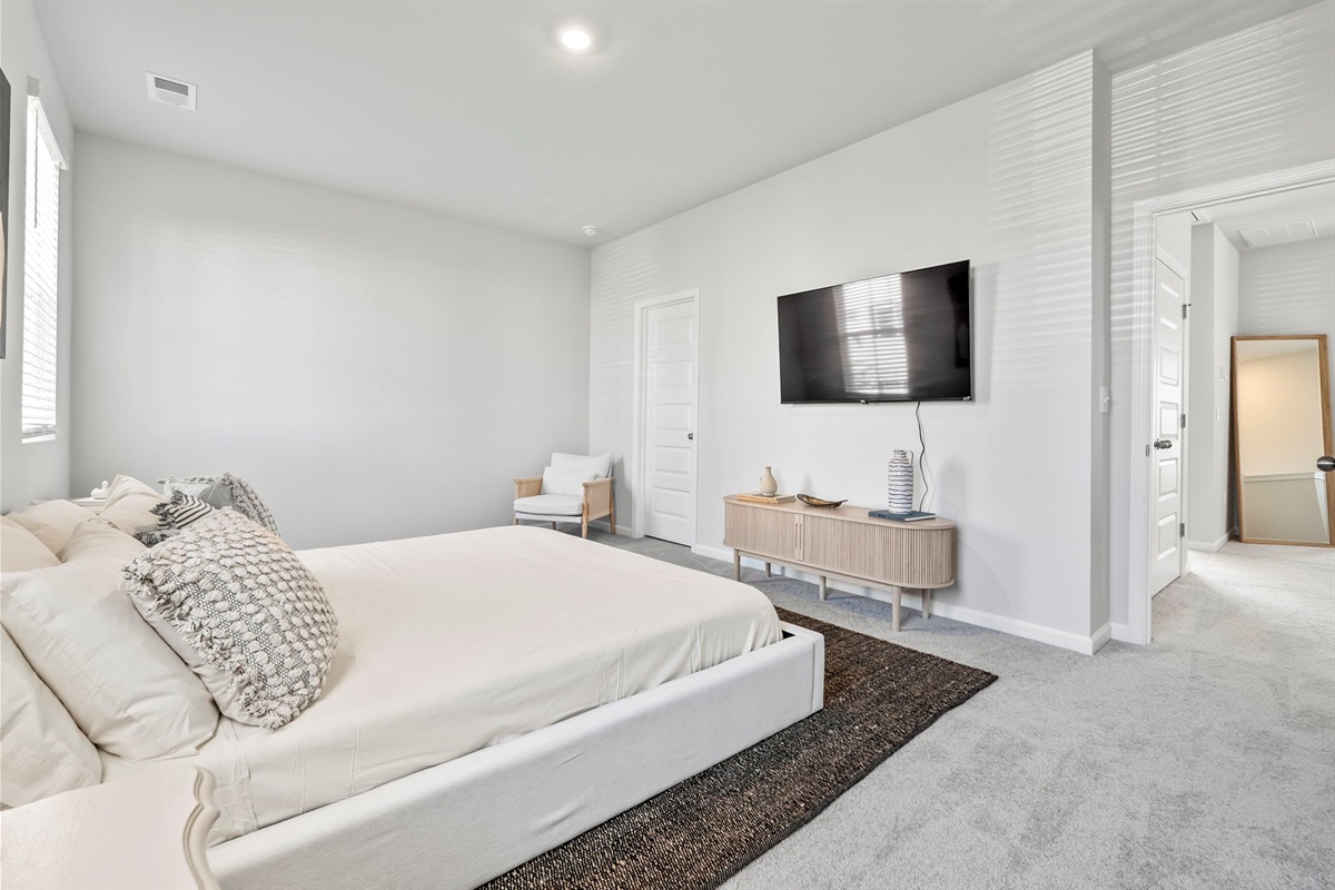 Master Bedroom with King Bed, walk in closet, ensuite bathroom and Roku Smart TV