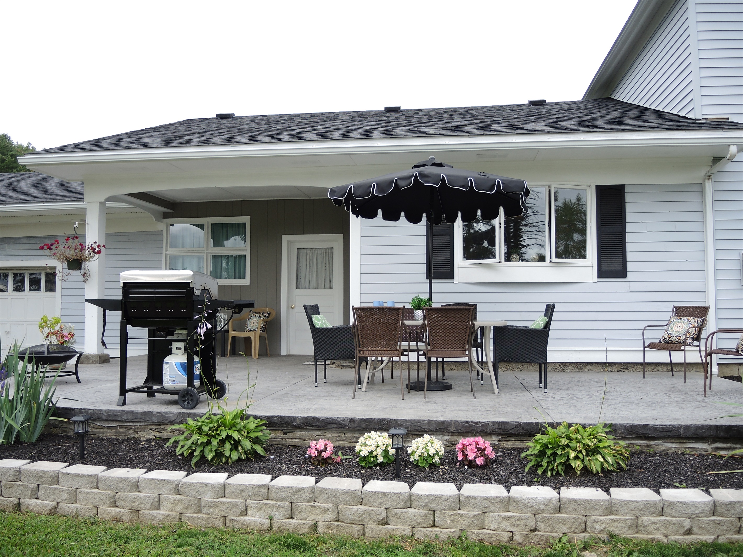 Patio w/ outdoor dining and gas grill