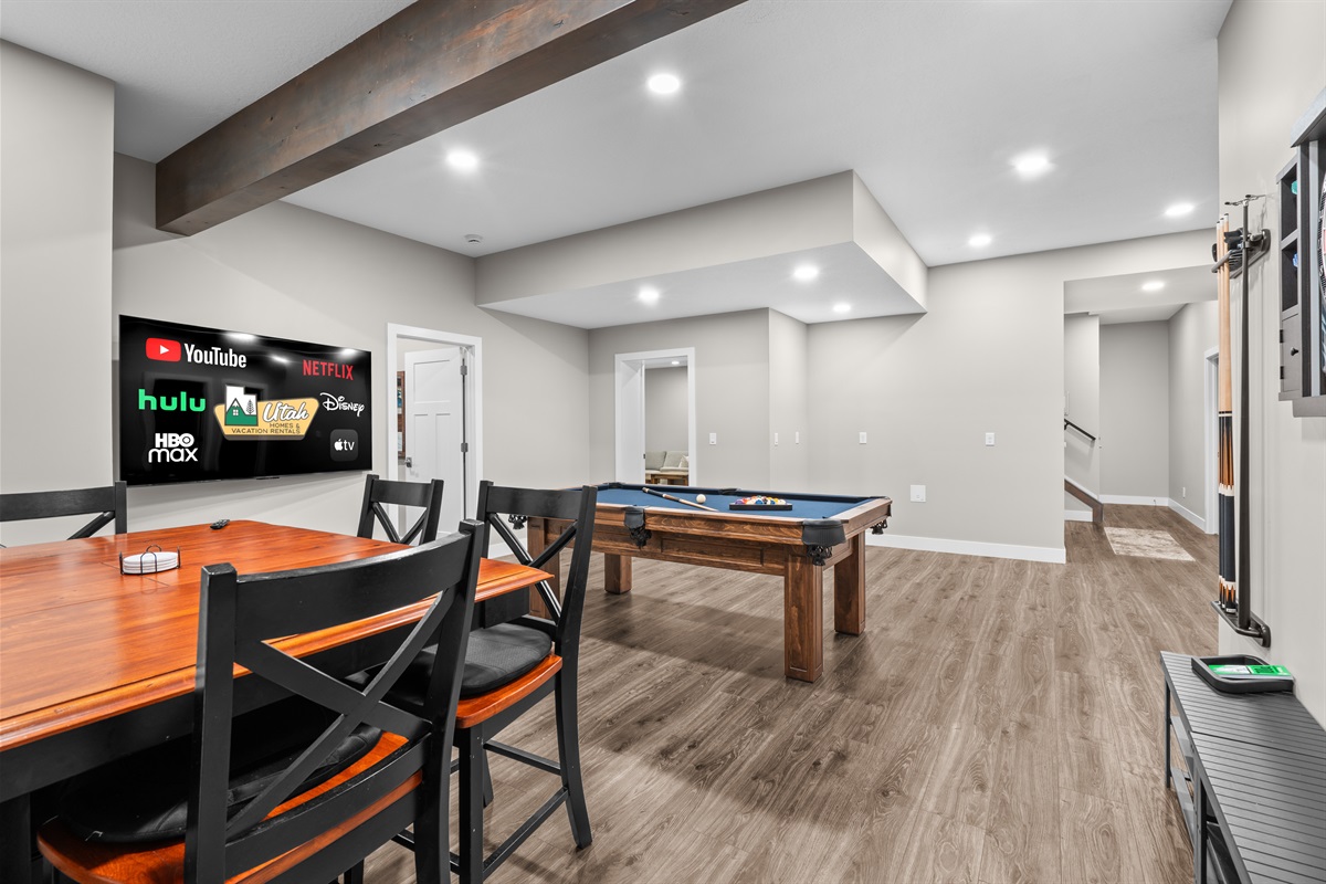 Versatile rec room offering games, TV viewing, and space to unwind together.