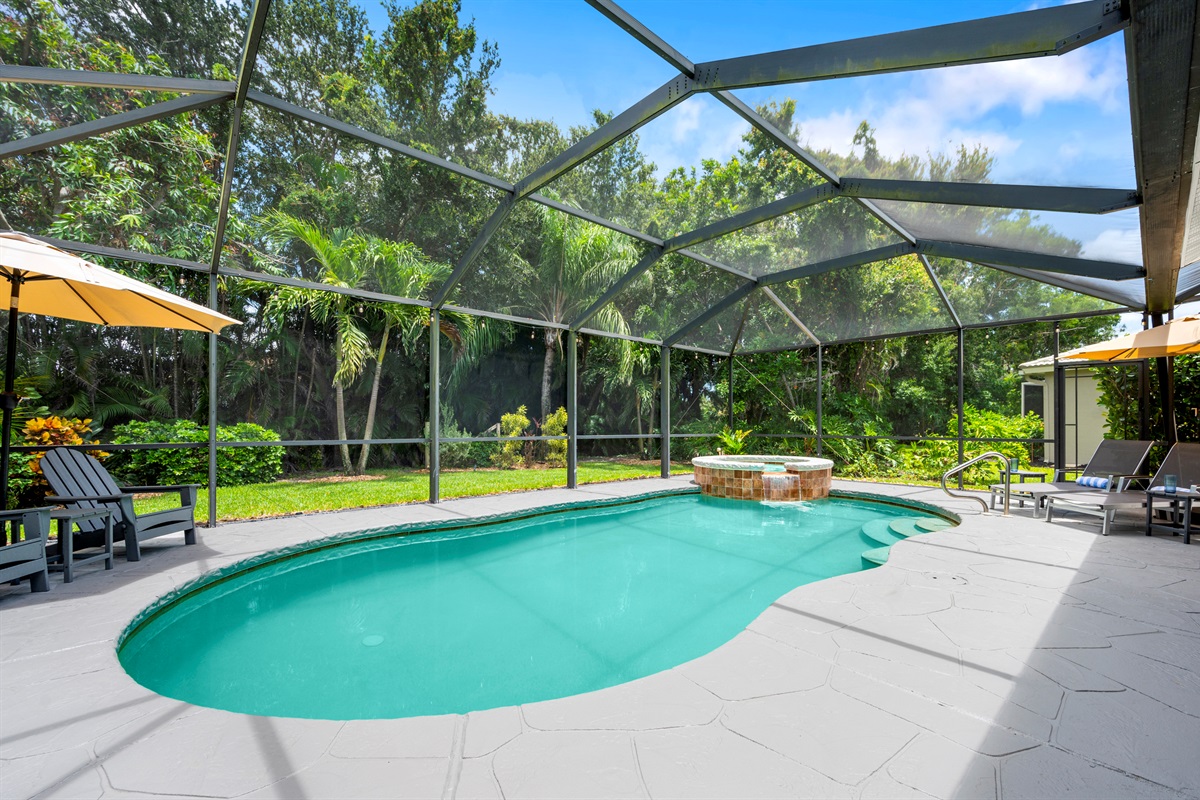Elegant lanai with dining, lounging, and uninterrupted pool views