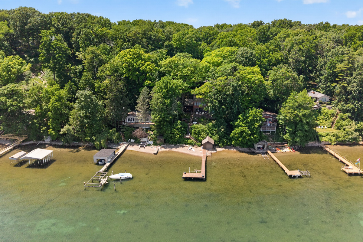 Multiple docks along the wooded shoreline