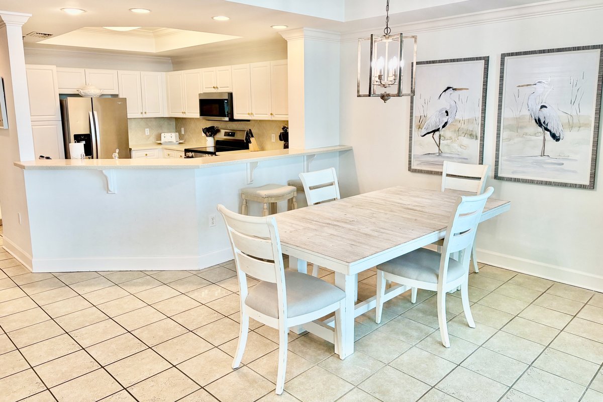 Seating for 4 at the dining table and two at the kitchen bar.