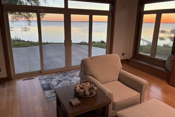 Family room view out to patio and lake sunrise