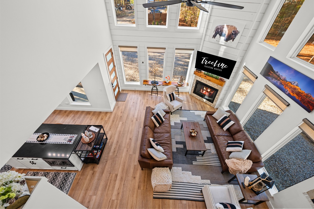 Looking down from above, the open-concept layout highlights the tall ceilings and thoughtful flow between spaces.