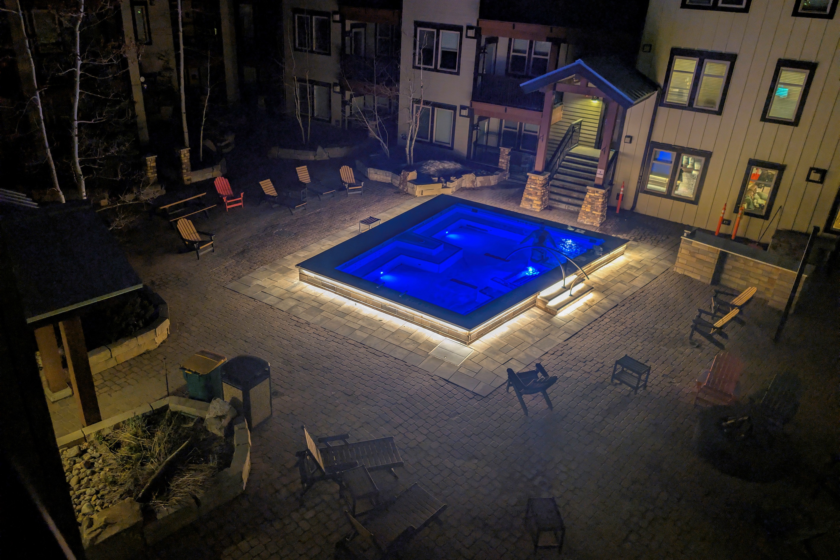 Night view of hot tub from side of deck