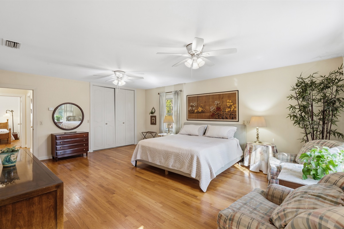 Bright, airy bedroom with ample space to relax