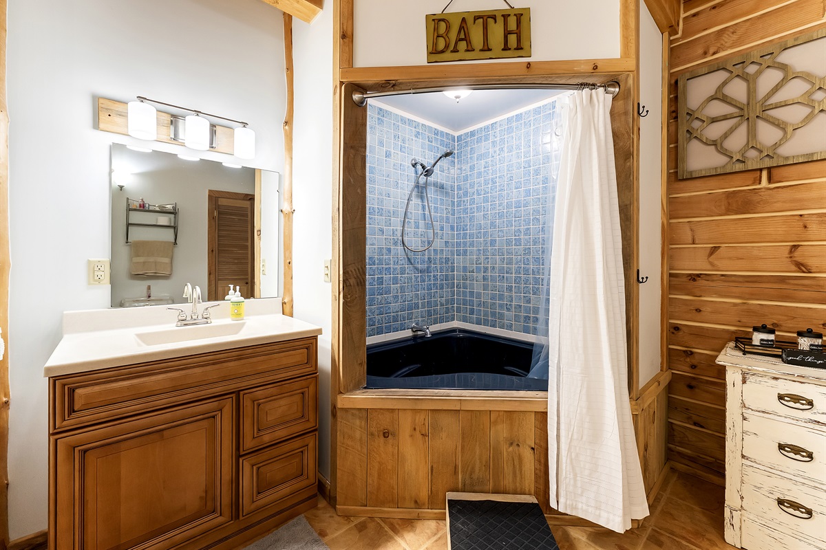 Second Master bedroom full bathroom with jetted bath tub and walk in closet.