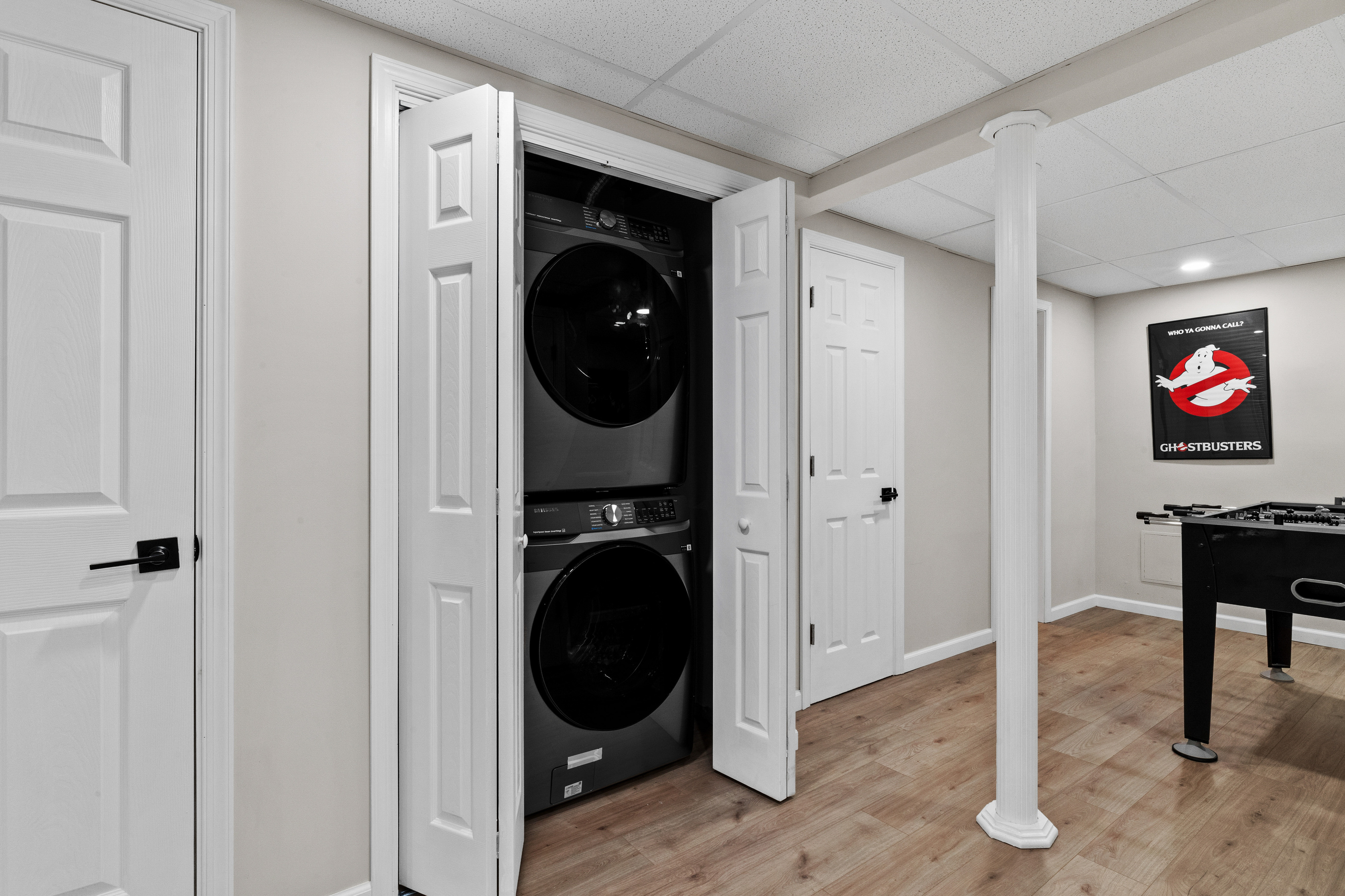 Full-sized washer and dryer are located in their own dedicated space, with premium laundry pods included