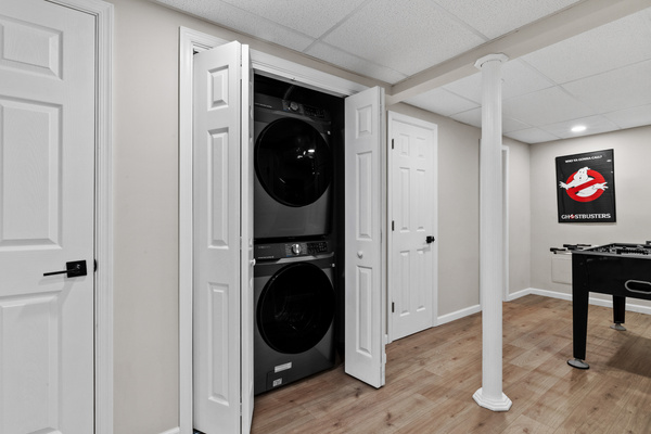 Full-sized washer and dryer are located in their own dedicated space, with premium laundry pods included