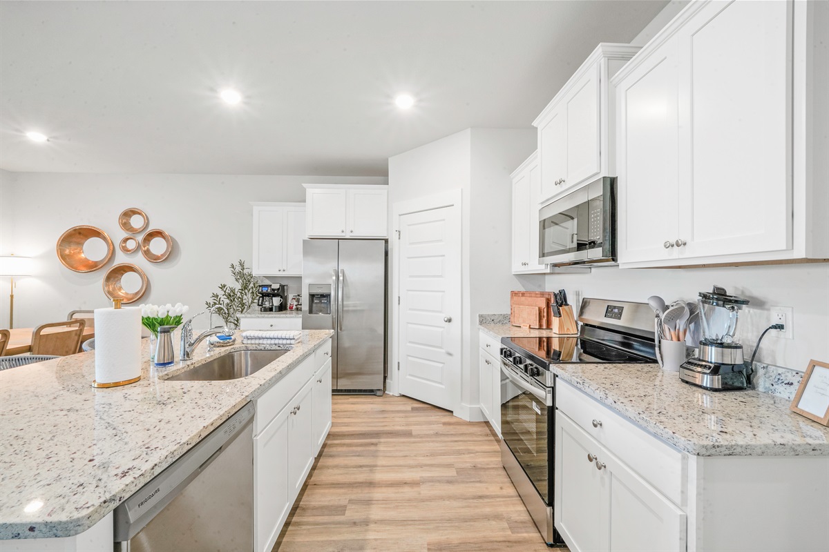 Fully stocked kitchen with modern appliances and plenty of space to cook. Perfect for family meals, gatherings, and morning coffee