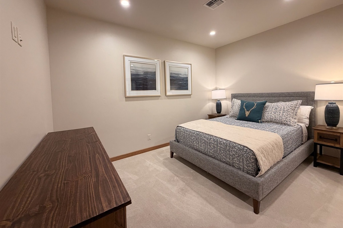 Comfortable luxury meets timeless design in this spacious bedroom retreat.
