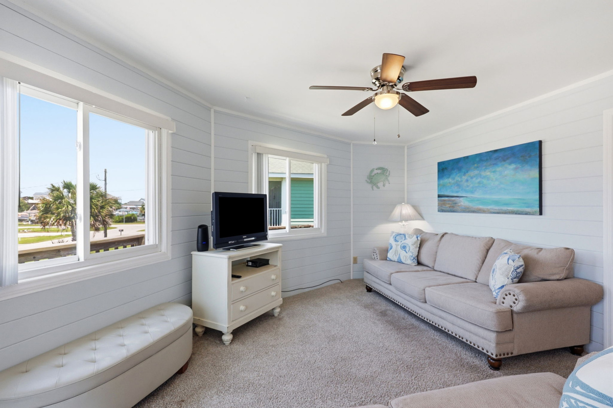 Natural light fills this cozy coastal living space