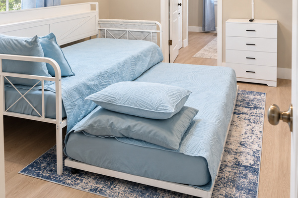Bright twin room with cosy bedding, perfect for friends or family stays.