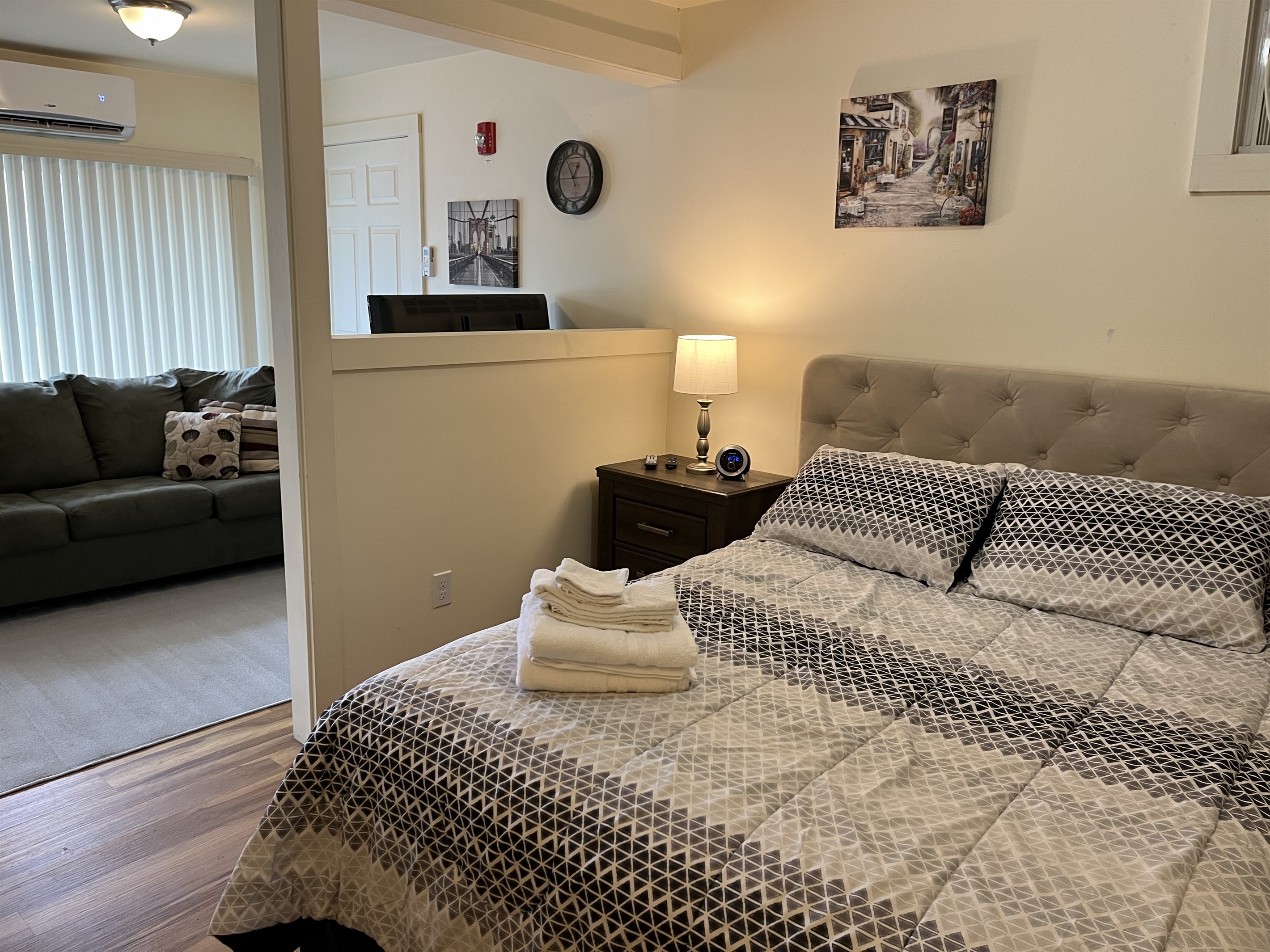 Queen sleeping area with living area beyond