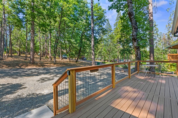 Peaceful forest views and a spacious deck make this the perfect spot to relax outdoors.