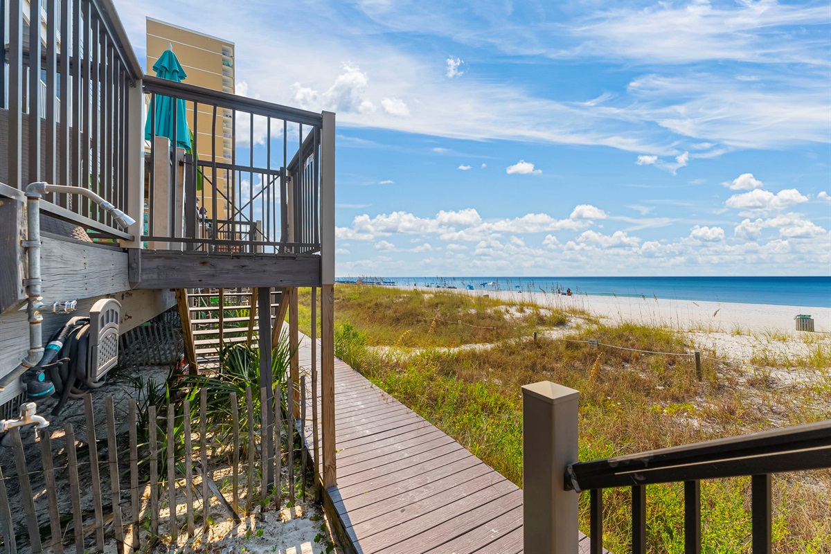 Your own private boardwalk straight to the sand — with an outdoor shower to rinse off after the waves.