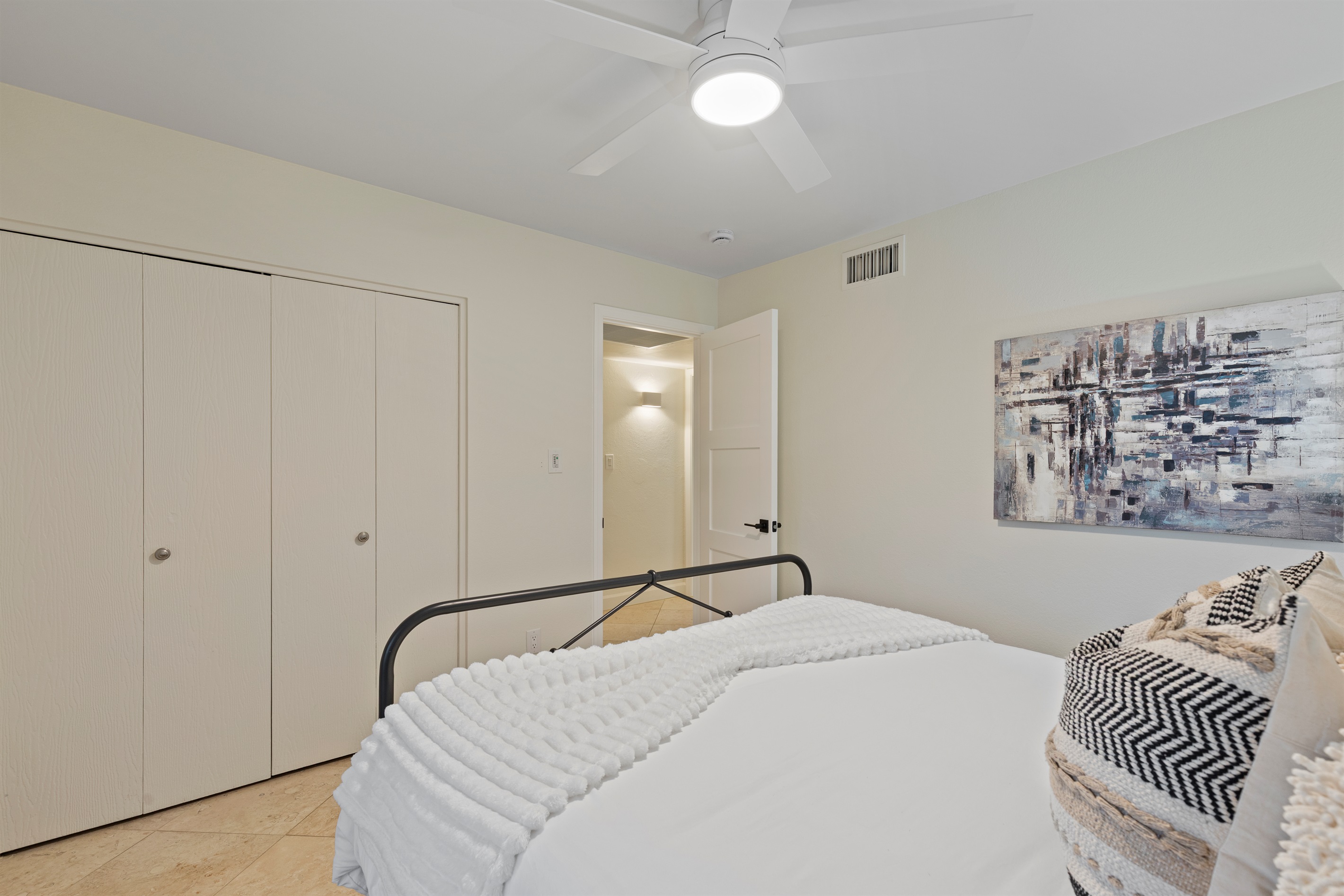 Guest bedroom with ample closet space and a functional layout