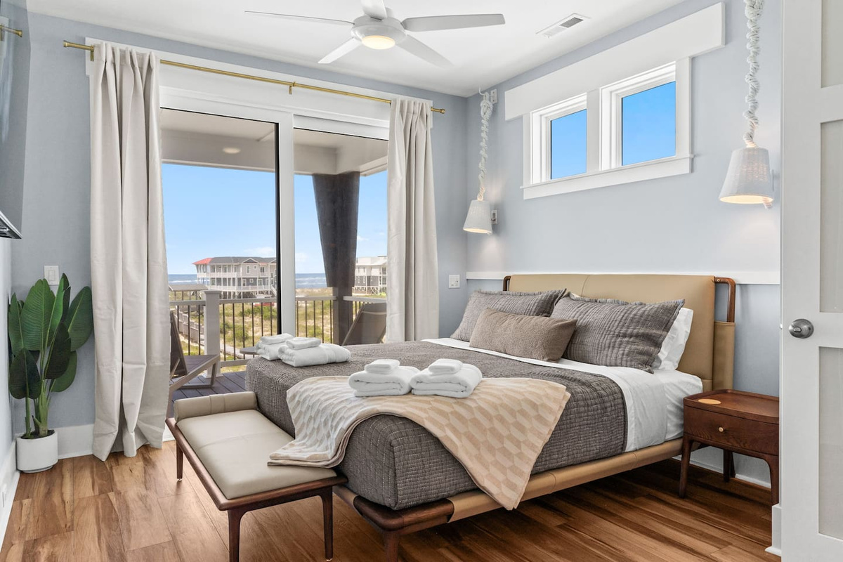 WOW! The upstairs primary suite is a true retreat. Step onto your private balcony and take in sweeping ocean views, creating the perfect space to relax, recharge, and enjoy the beauty of Oak Island.