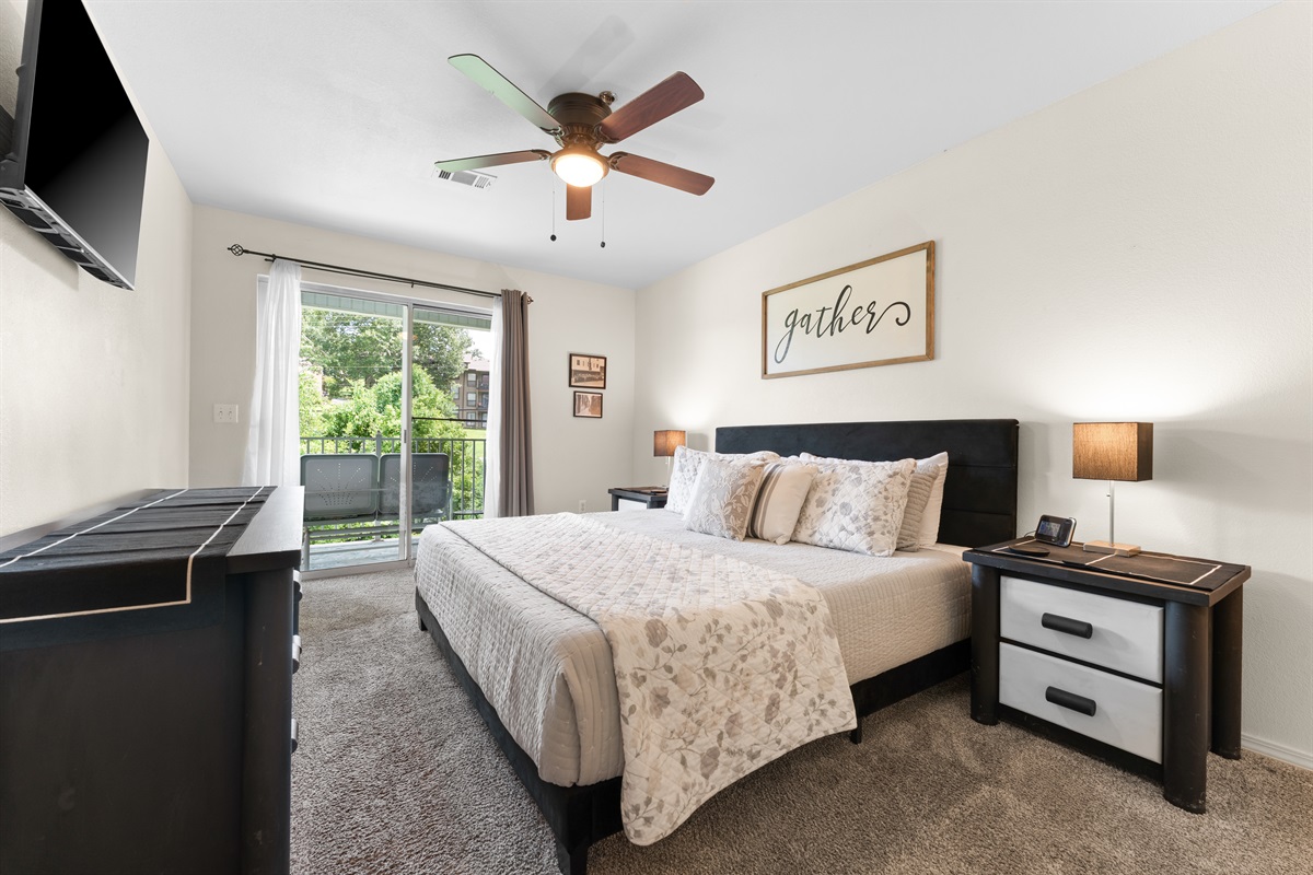 The king suite gives you a calm, comfortable place to recharge, with direct access to the deck just beyond the slider.