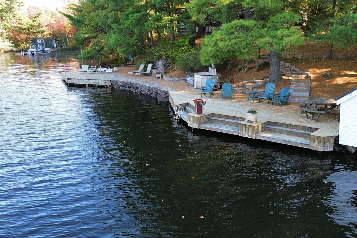 Sunning patio-fire pit-wood burning cedar hot tub-stairs from deck into a shallow "family friendly" swimming area-boat house 