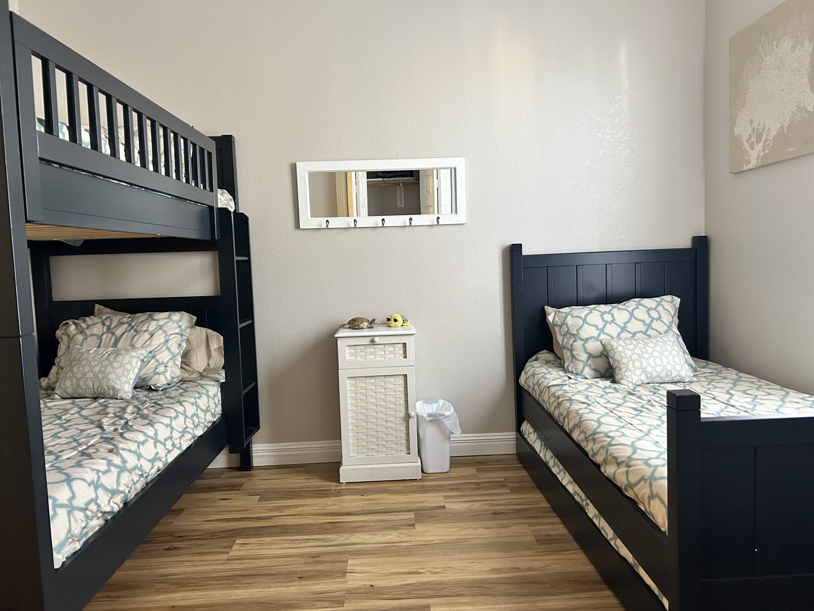 This bunk room sleeps up to 4 guests with a twin-over-twin bunk bed, plus a twin bed with a pullout trundle. Coastal-inspired décor, hardwood floors, and an HDTV make it the perfect retreat for kids or additional guests.