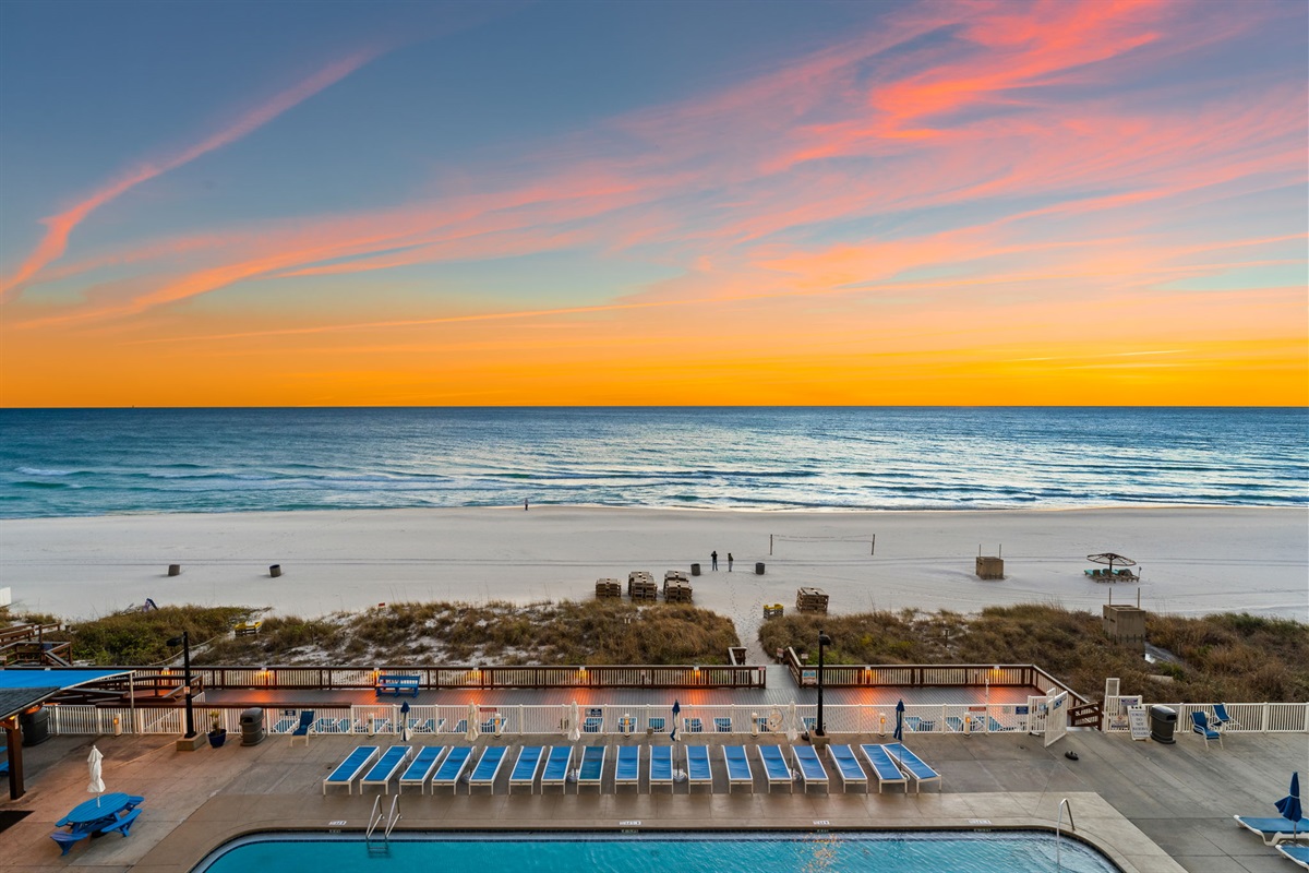 Twilight view from the balcony, pool, beach and ocean