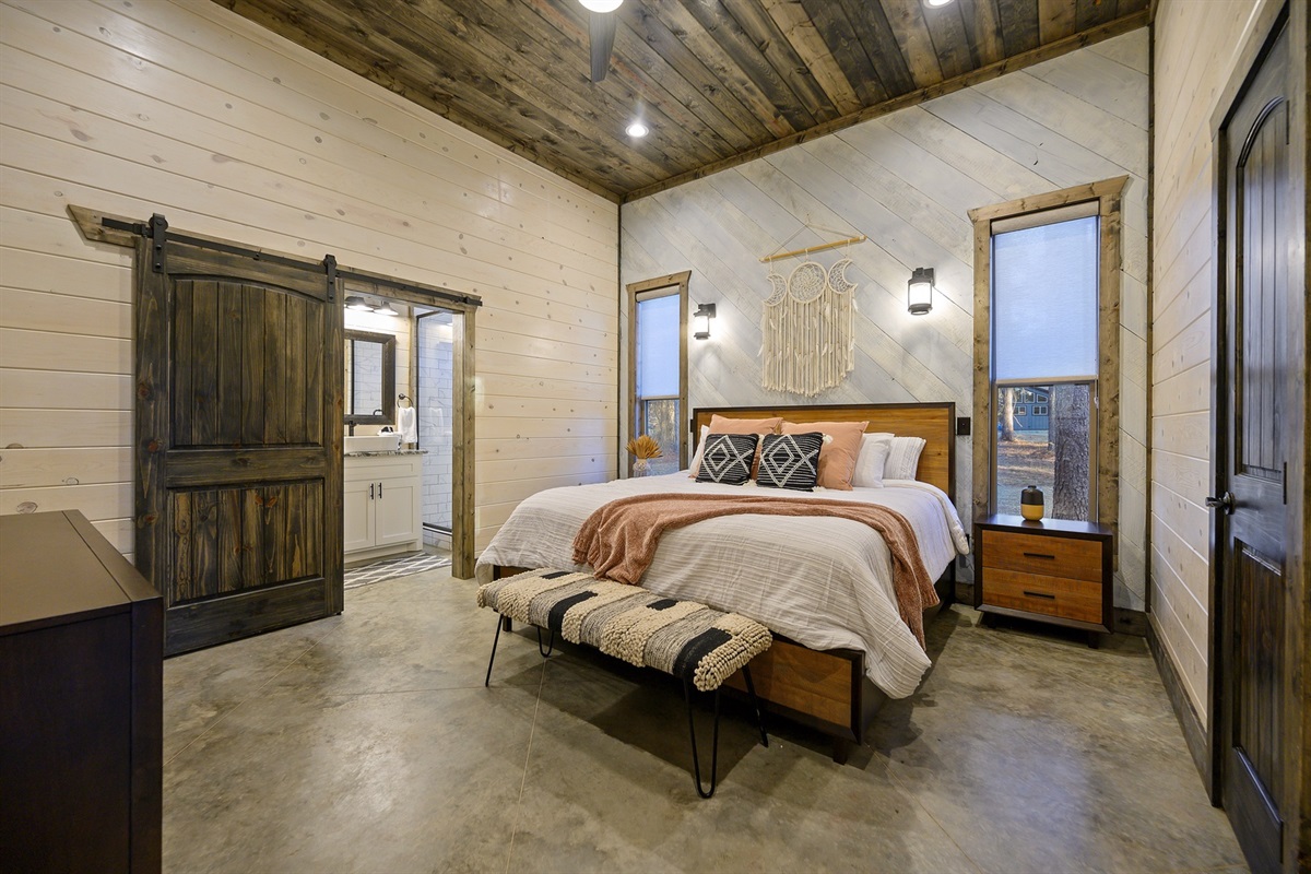 Relax into plush bedding and peaceful forest views for a restful night at Piece of the Moon.