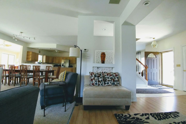 From fireplace looking towards kitchen (left) and front door (right).