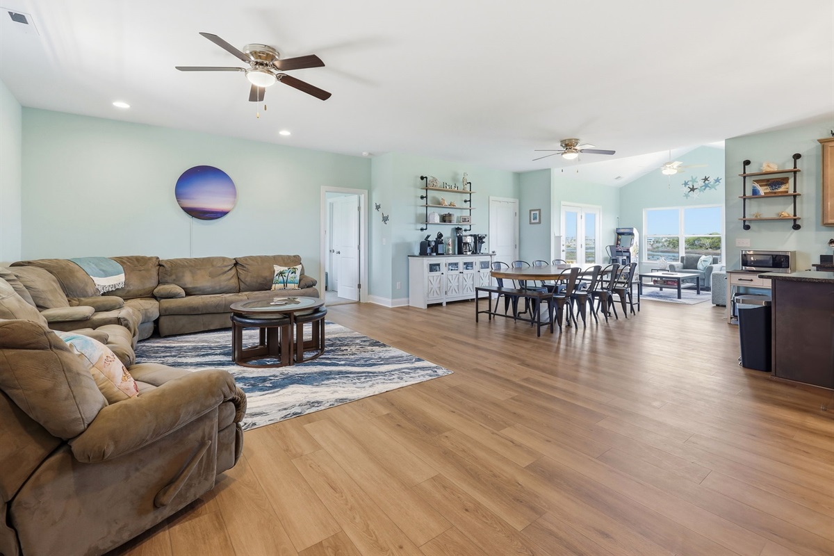 Spacious open-concept layout connecting living, dining, and kitchen areas