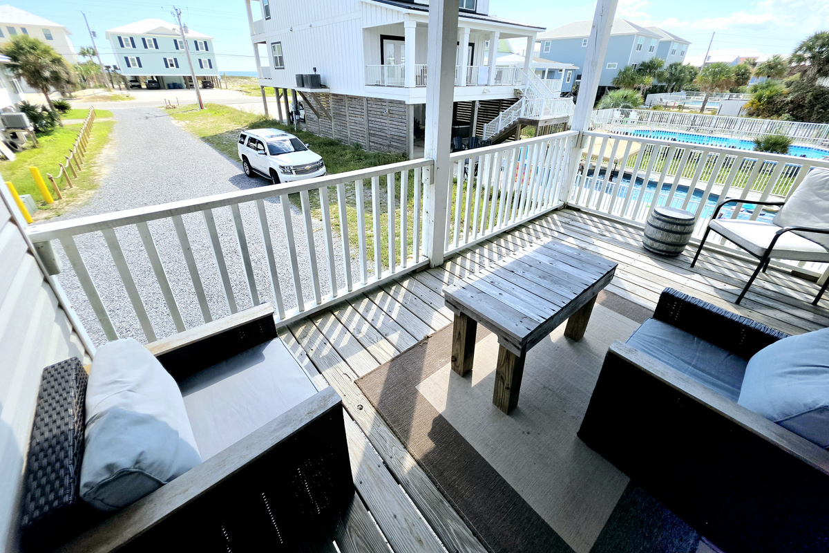 Furnished covered balcony with seating