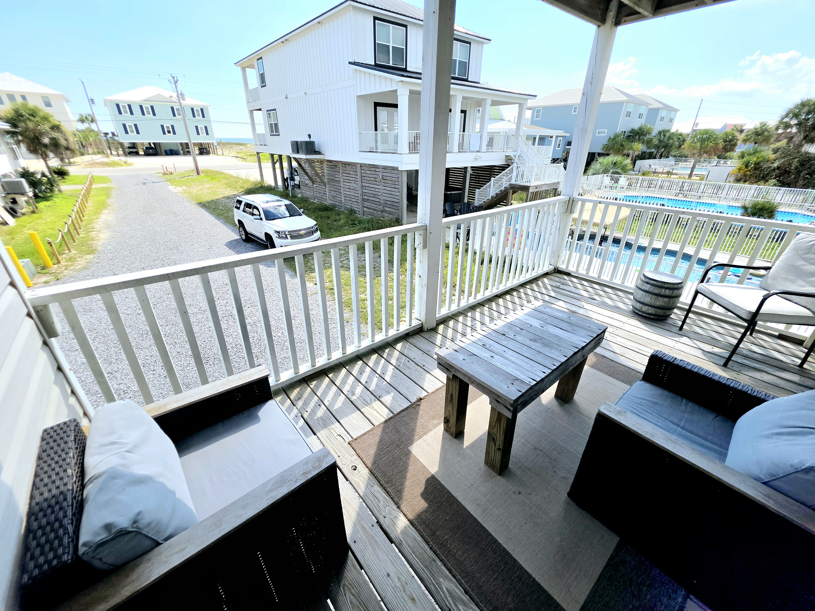 Furnished covered balcony with seating