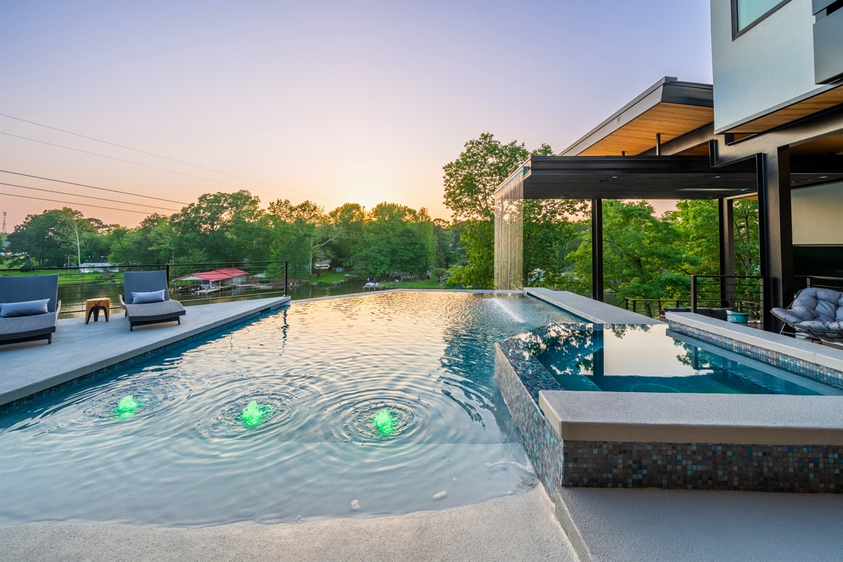 Enjoy the seamless transition between the pool and the serene natural backdrop, perfect for a peaceful retreat.